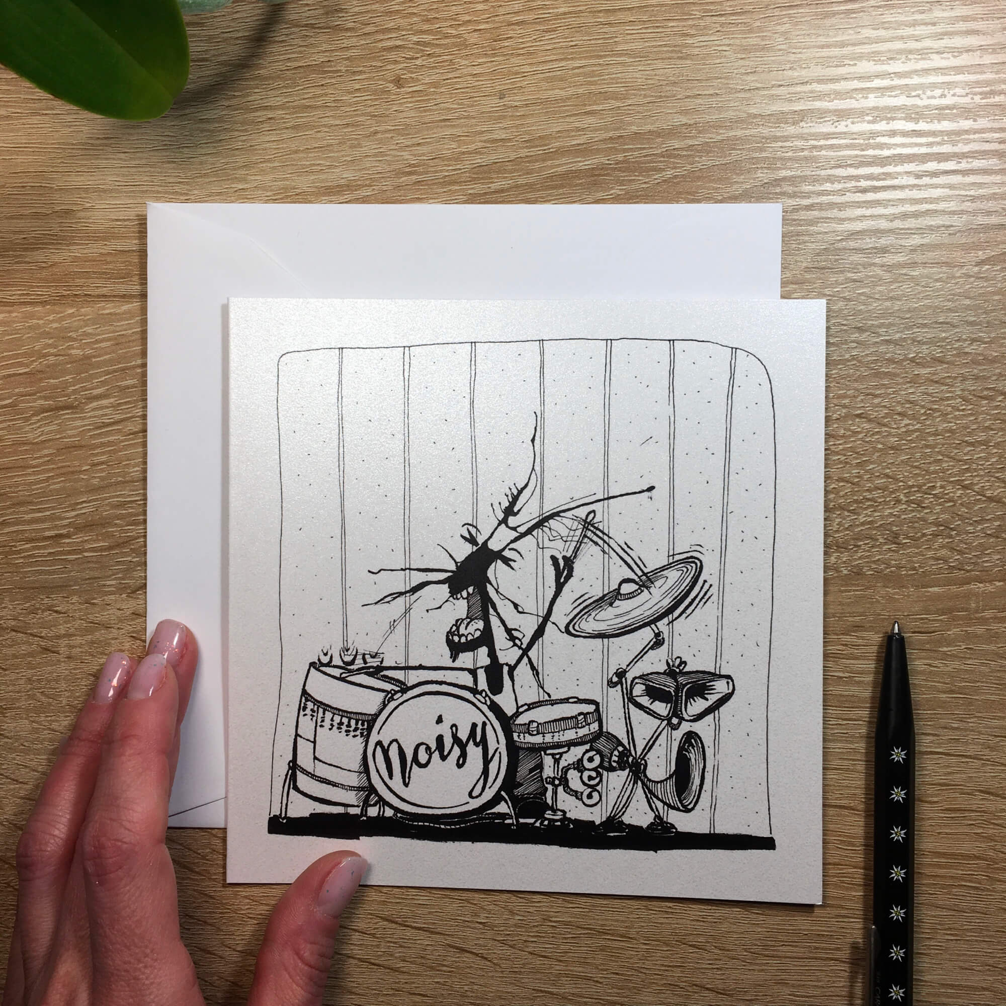 Ticket with ink stain: little monster plays drums