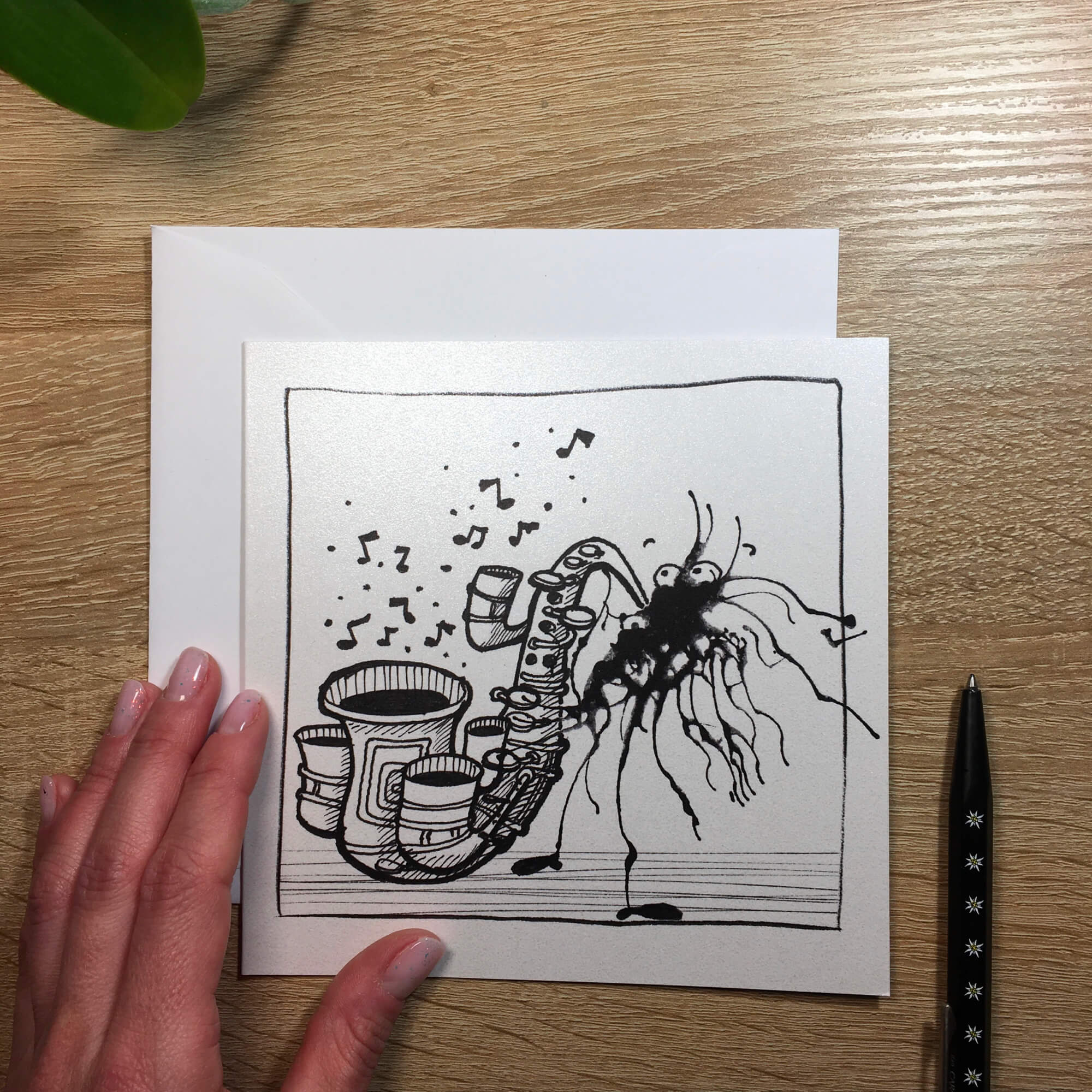 Ticket with ink stain: a little monster plays the saxophone