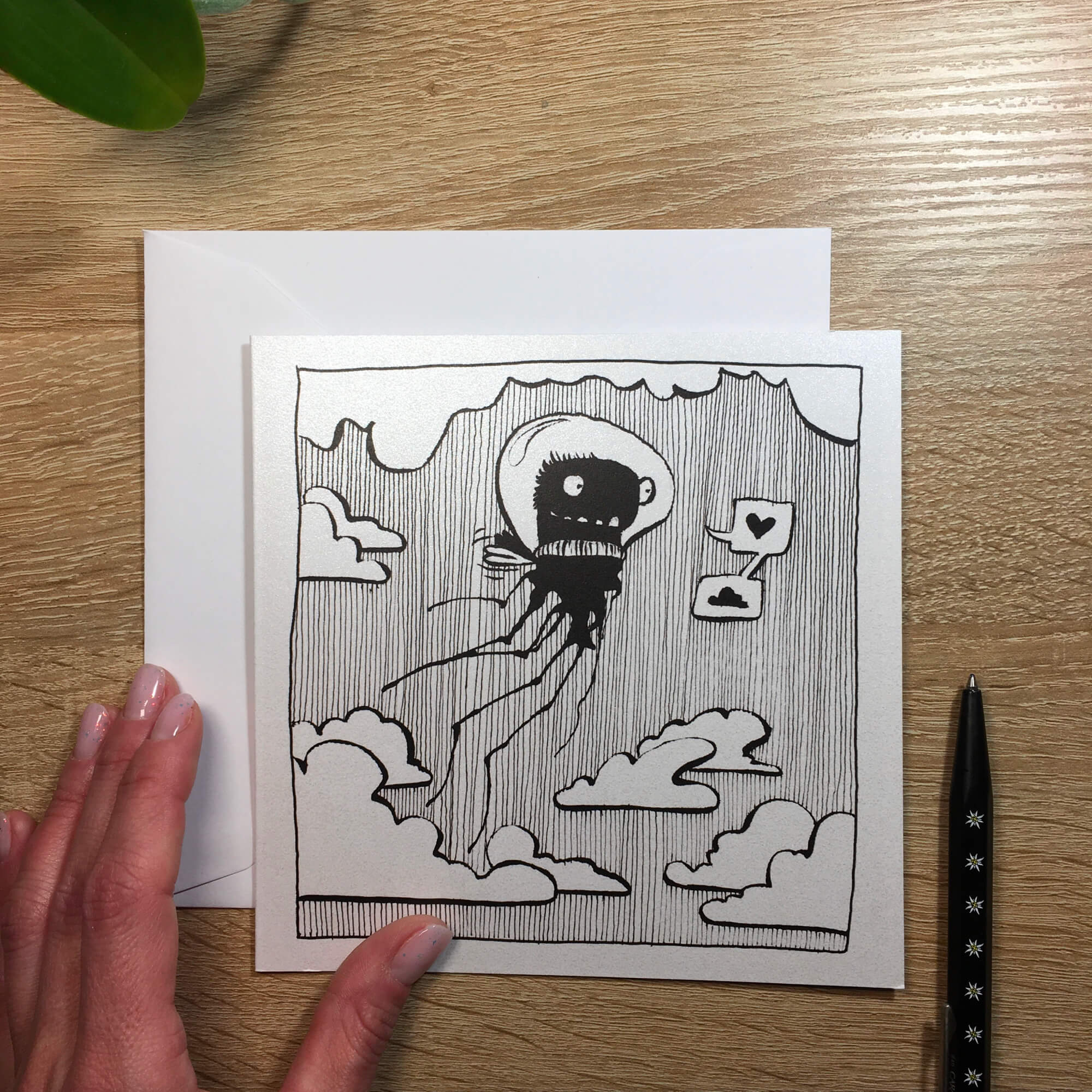 Ticket with ink stain: a little monster flies