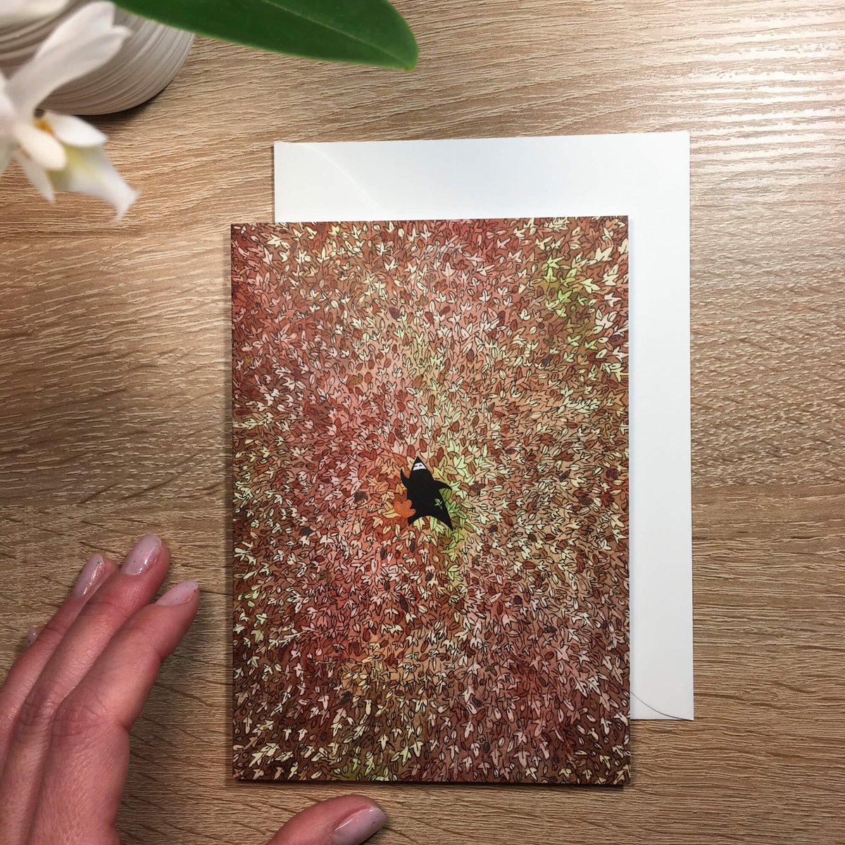 Card representing a season with autumn leaves